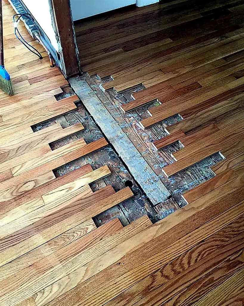 Water-damaged floor section under repair