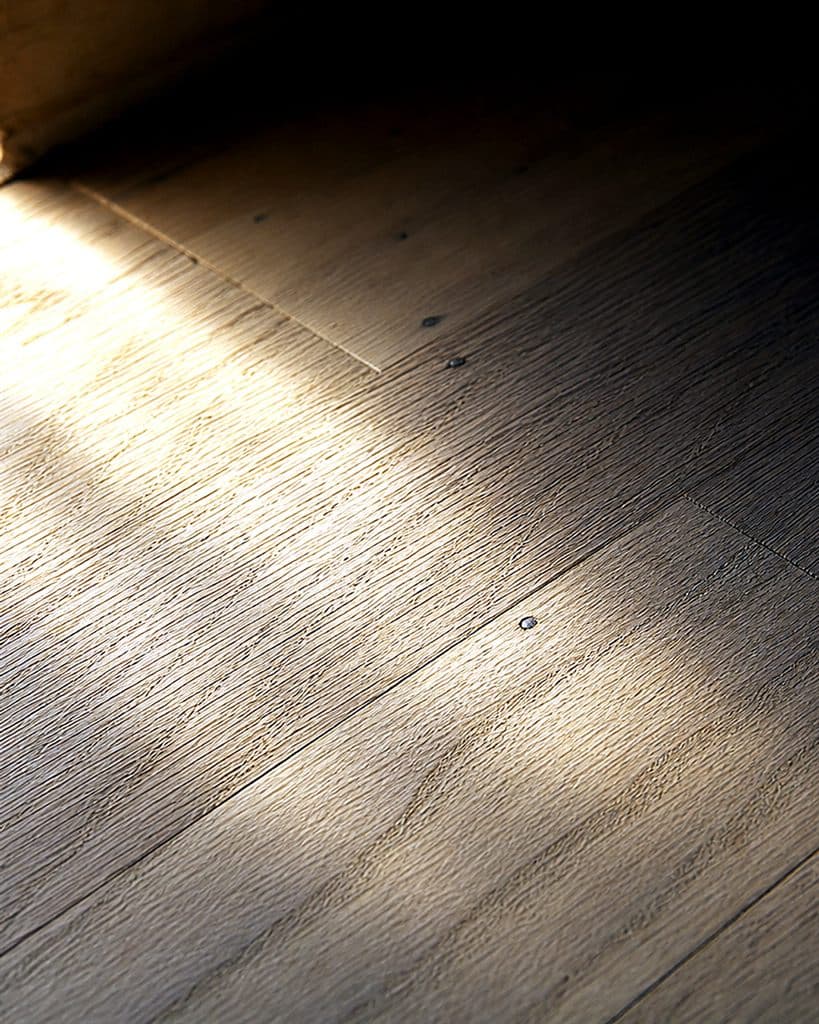 Red oak raw grain revealed after first sanding pass